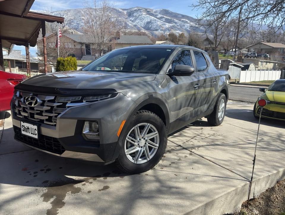 Hyundai Santa Cruz pickup after basic exterior wash - full side view with snowy Wasatch mountains in background